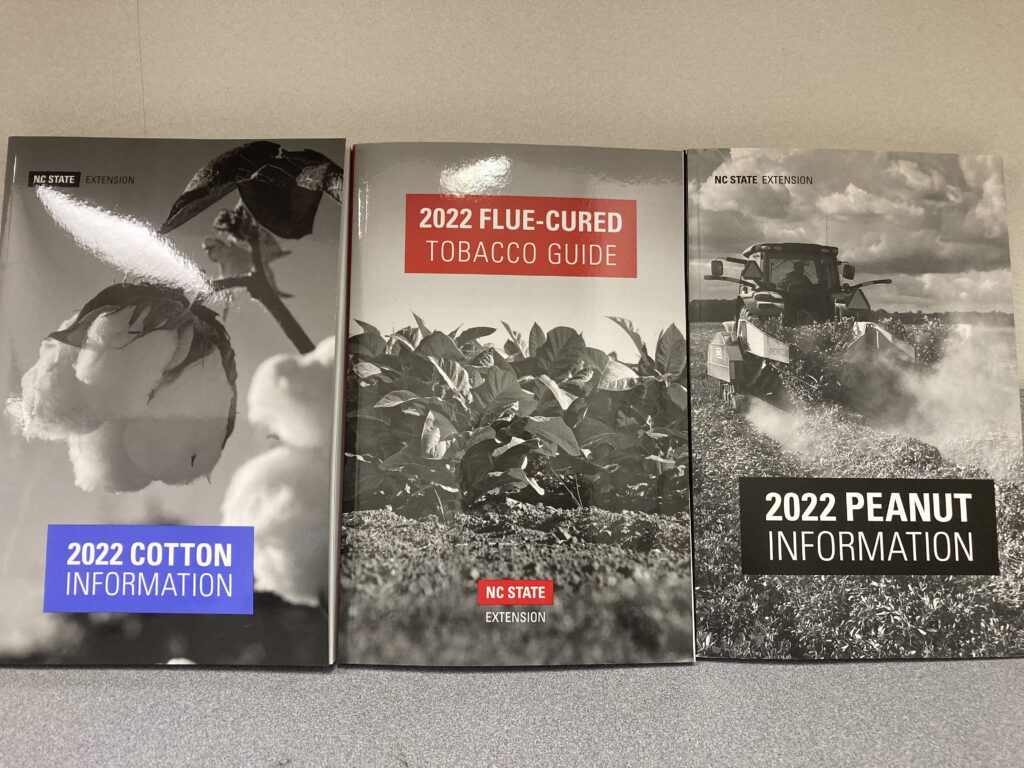 covers of the 2022 Cotton, Flue-Cured Tobacco and Peanut information guides.